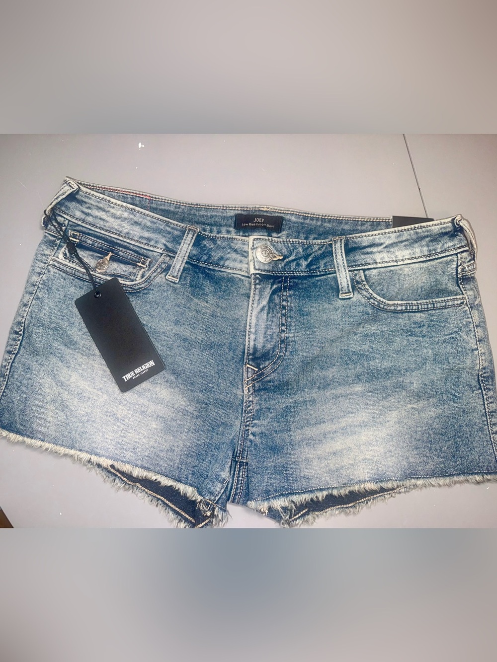 True Religion Joey Low Rise Cut-Off Denim Shorts in faded blue